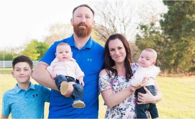 Russell and his wife and three children. 