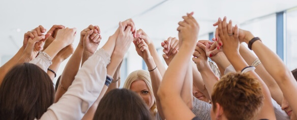 People at the end of a recovery meeting