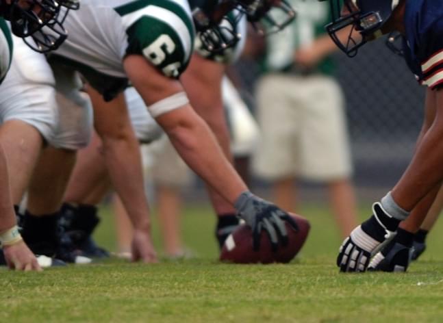 Football teams on the starting line