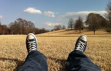 runaway teen sitting in the park