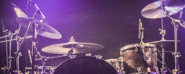 Full drum kit on stage for a concert