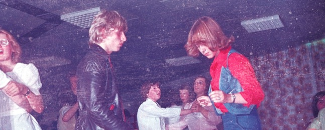 Couple dancing at a party in the 1970s