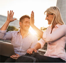 male and female high fiving their success