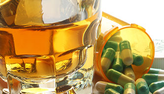 alcohol and pills on table