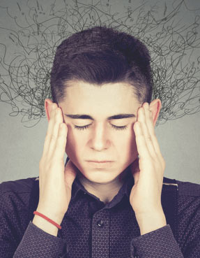 Young man struggling to concentrate.