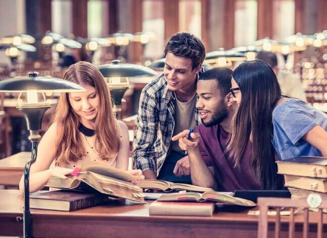 New York College Students studying in the library together