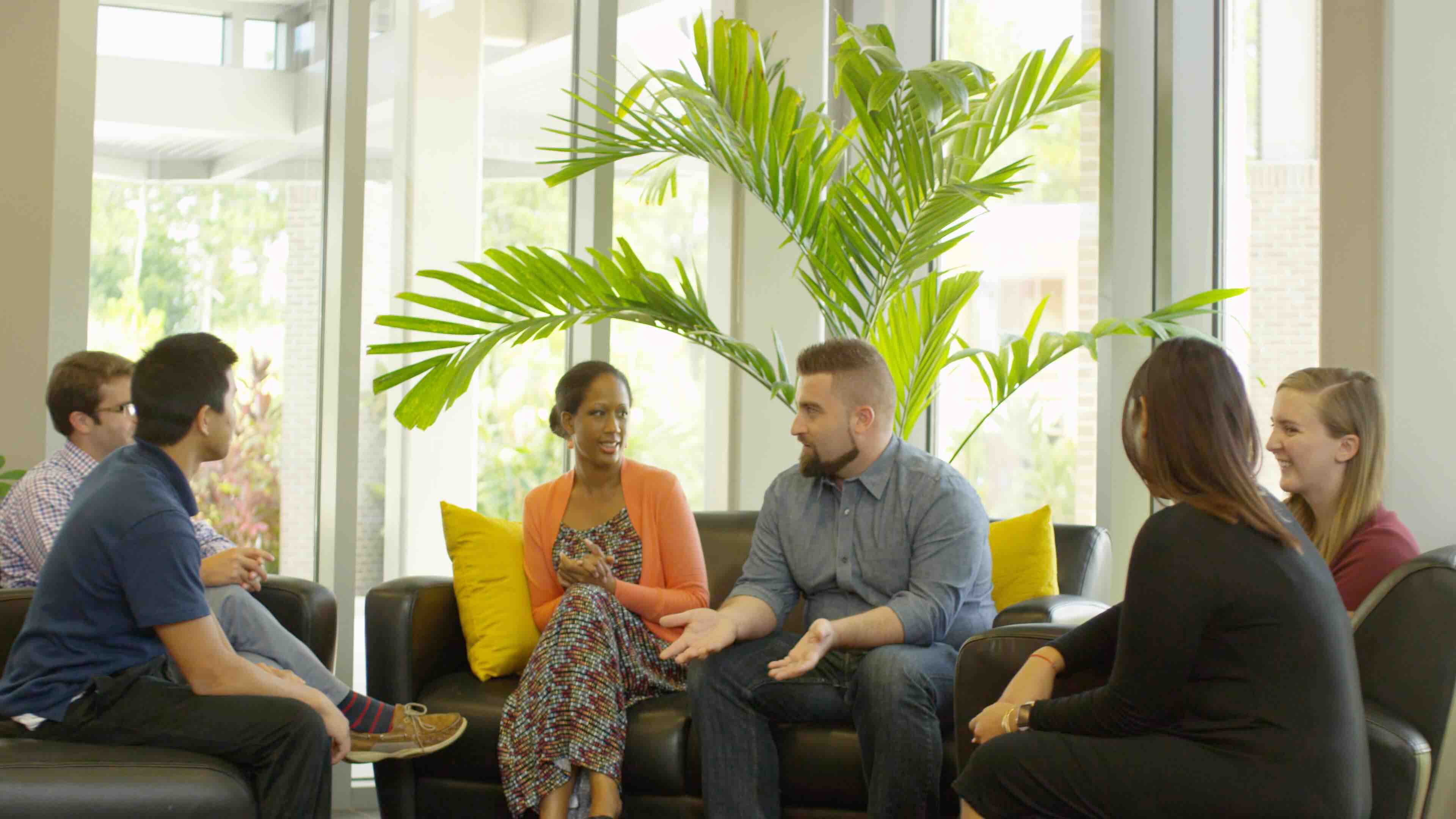 People Discussing a Topic at a Meeting