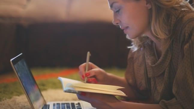 Woman Reading with laptop open