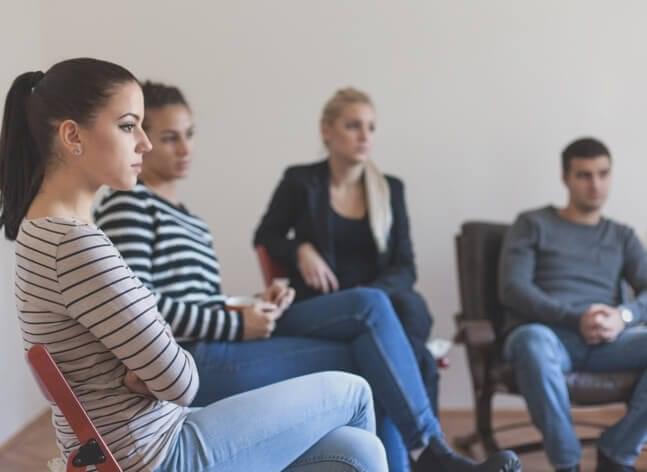 Support group sitting in a circle