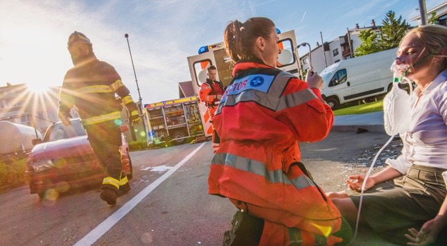 EMS helping a person who is having an alcohol overdose