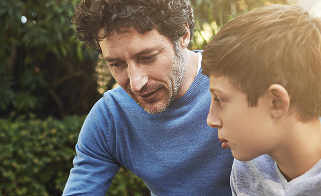 concerned father talks with his son
