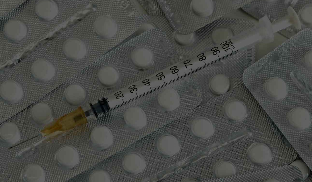 Heroin needle and pill paraphernalia