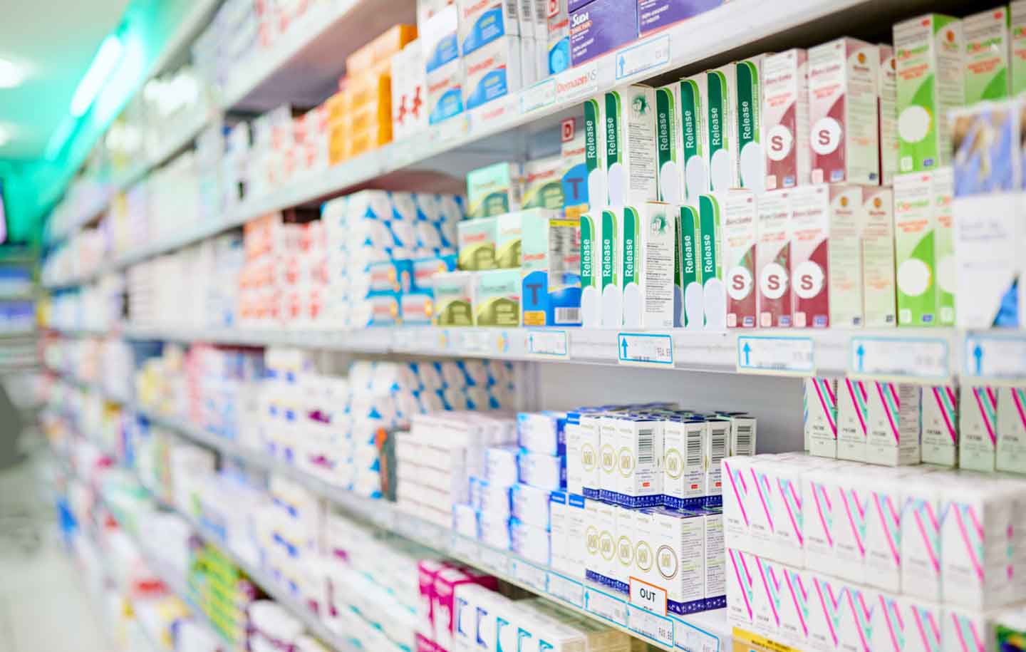Rows of prescription drugs at a pharmacy