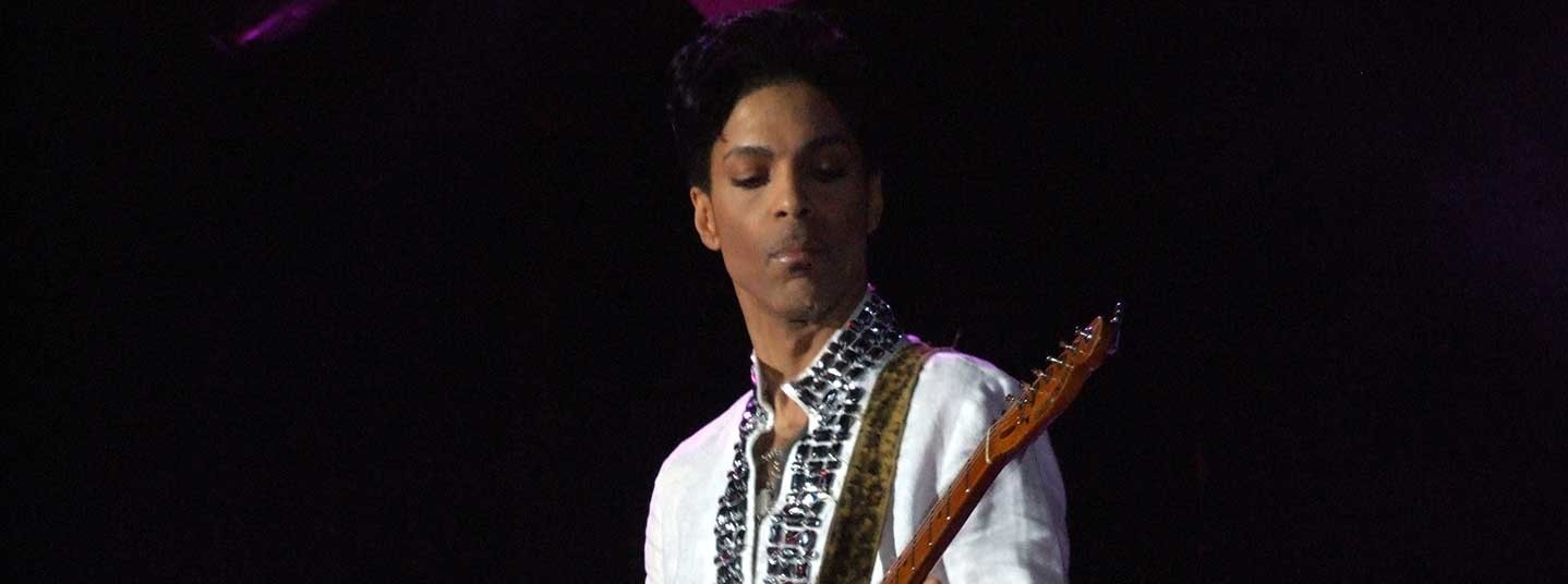 Prince performing on stage at a concert