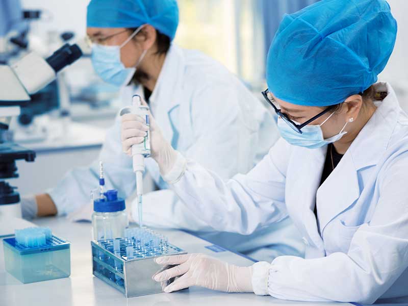 Young chemist in the laboratory running test