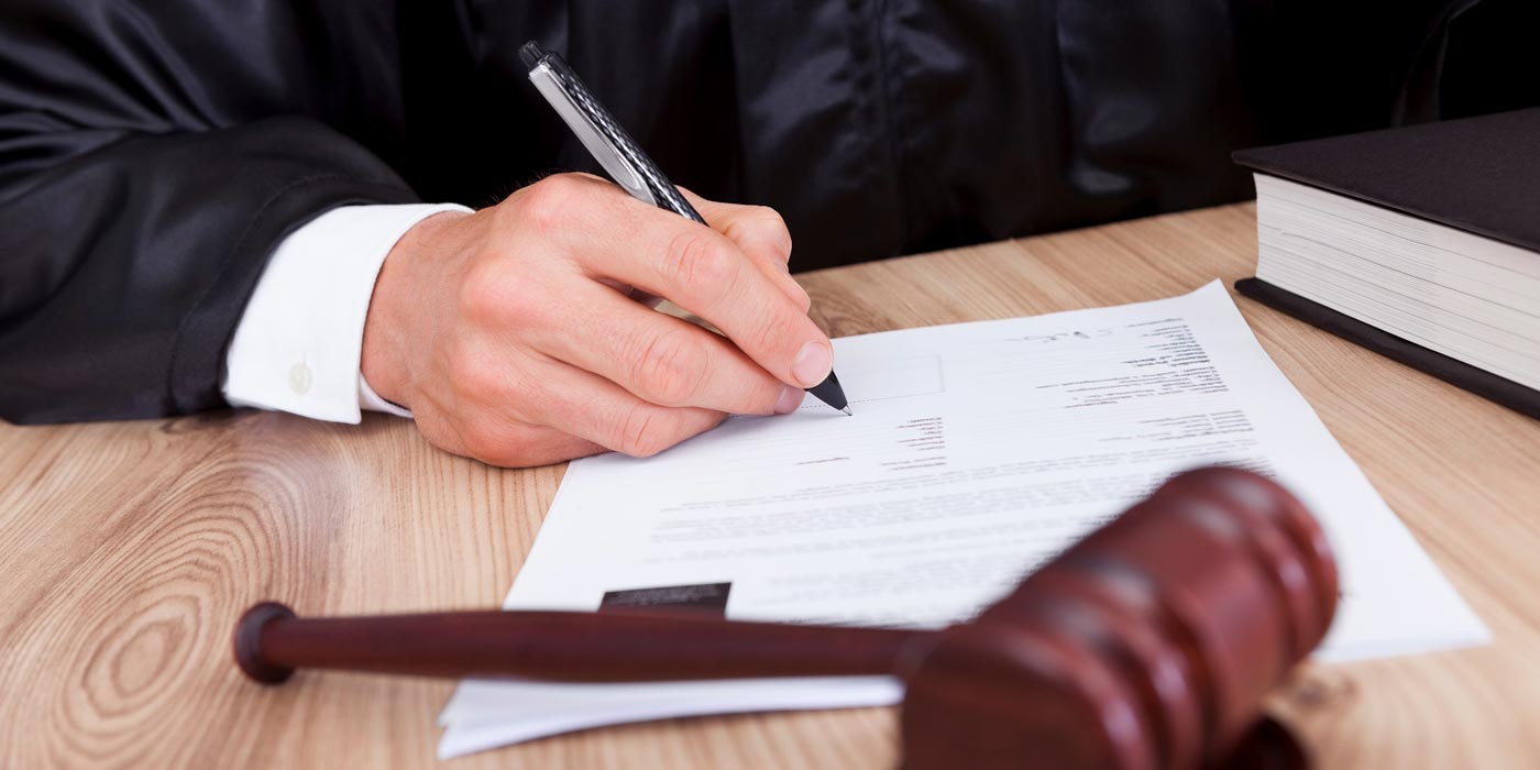 judge signing paperwork