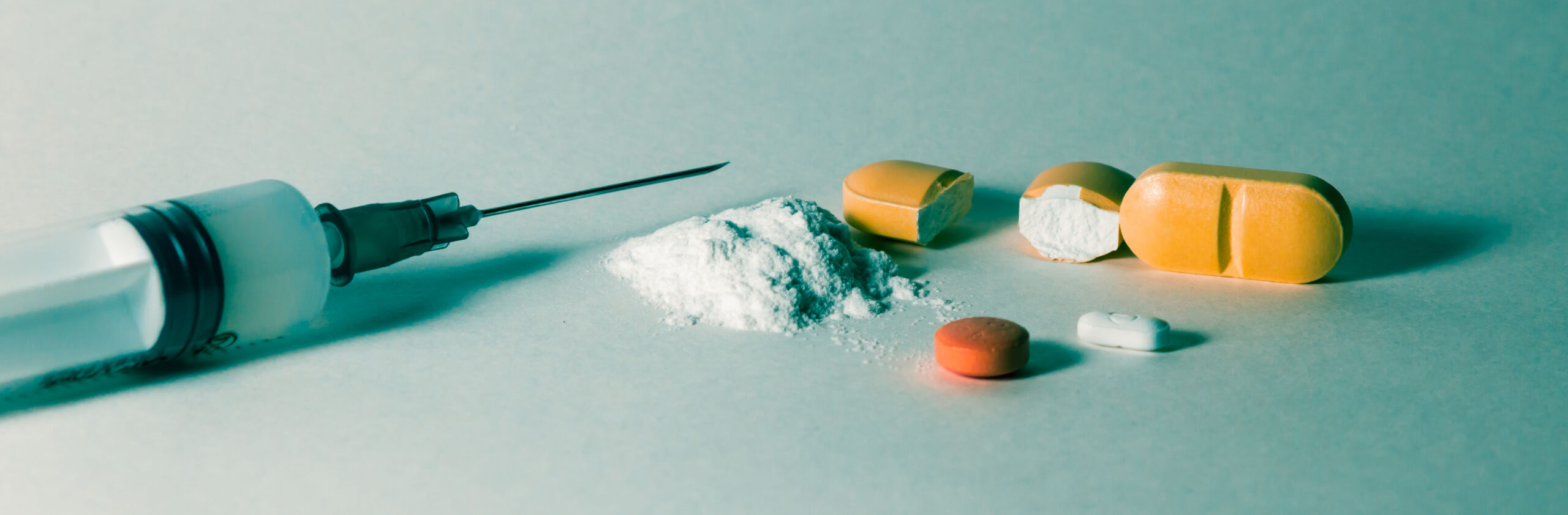 needle and crushed pills