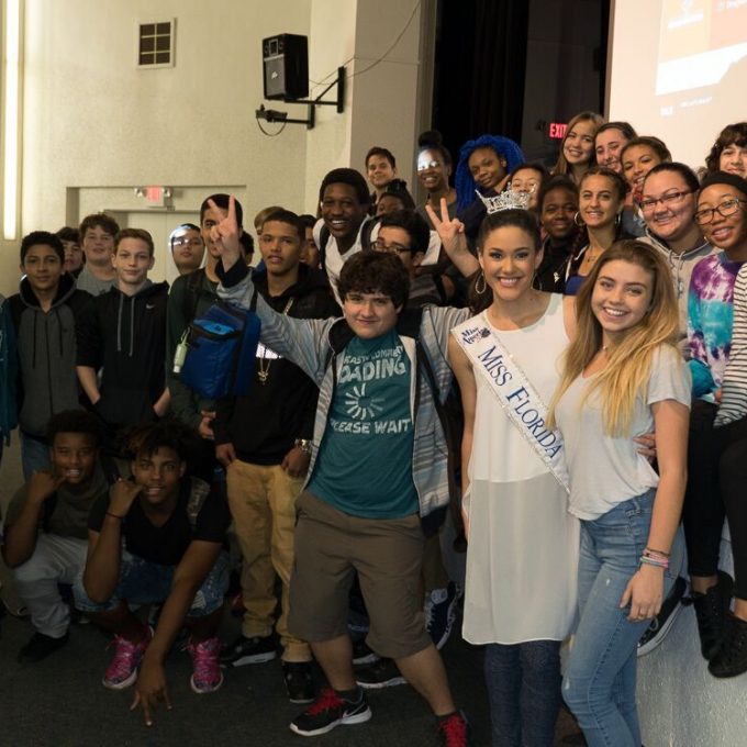 Courtney Sexton with high school students after Real Talk