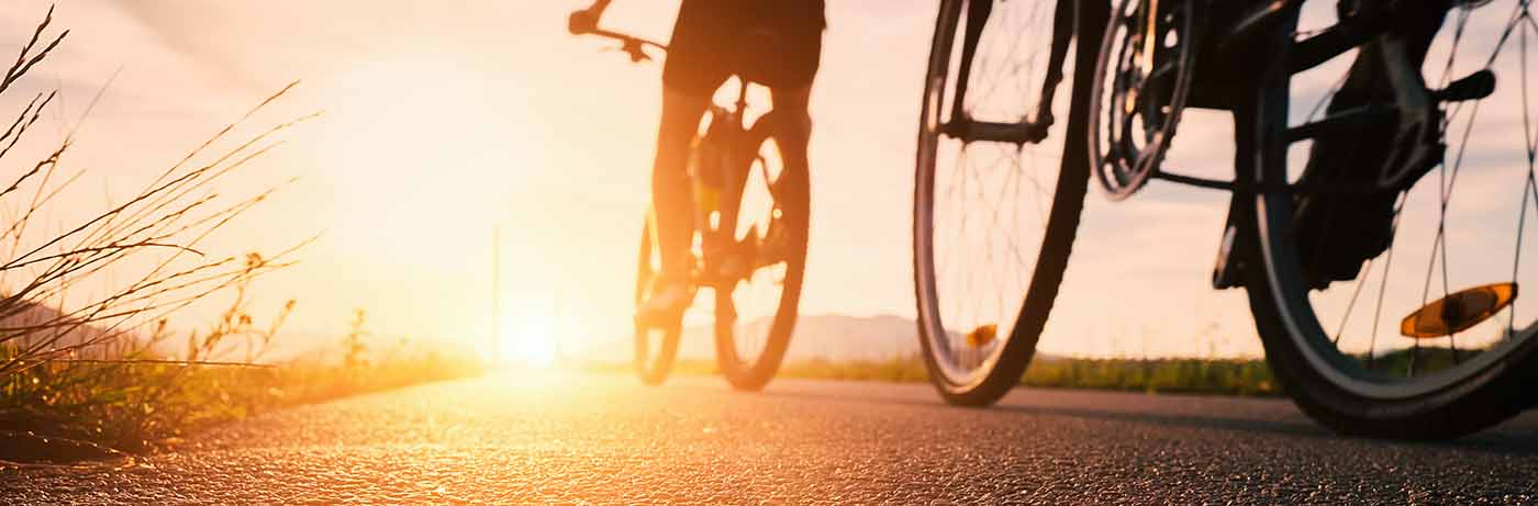 Bicycles riding off into sunset