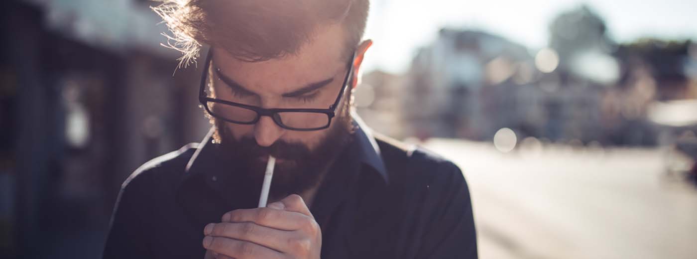 Man lighting a cigarette