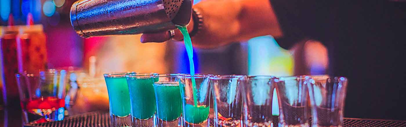 Shots being poured at a bar