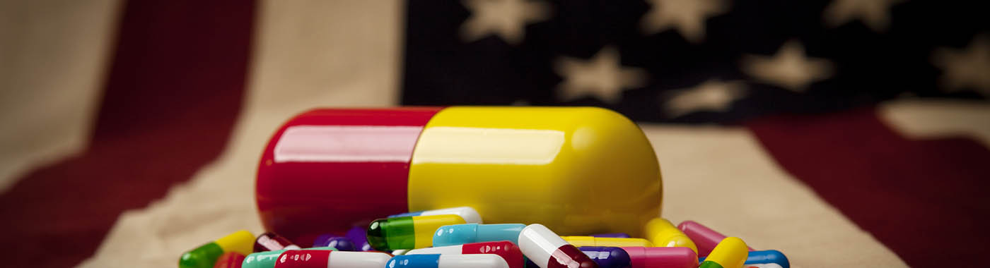 Pill capsules on an american flag