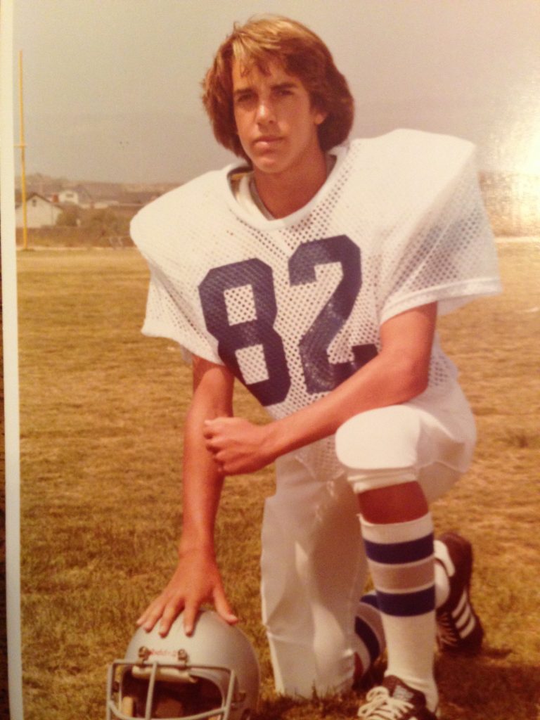 Randy in high school football uniform